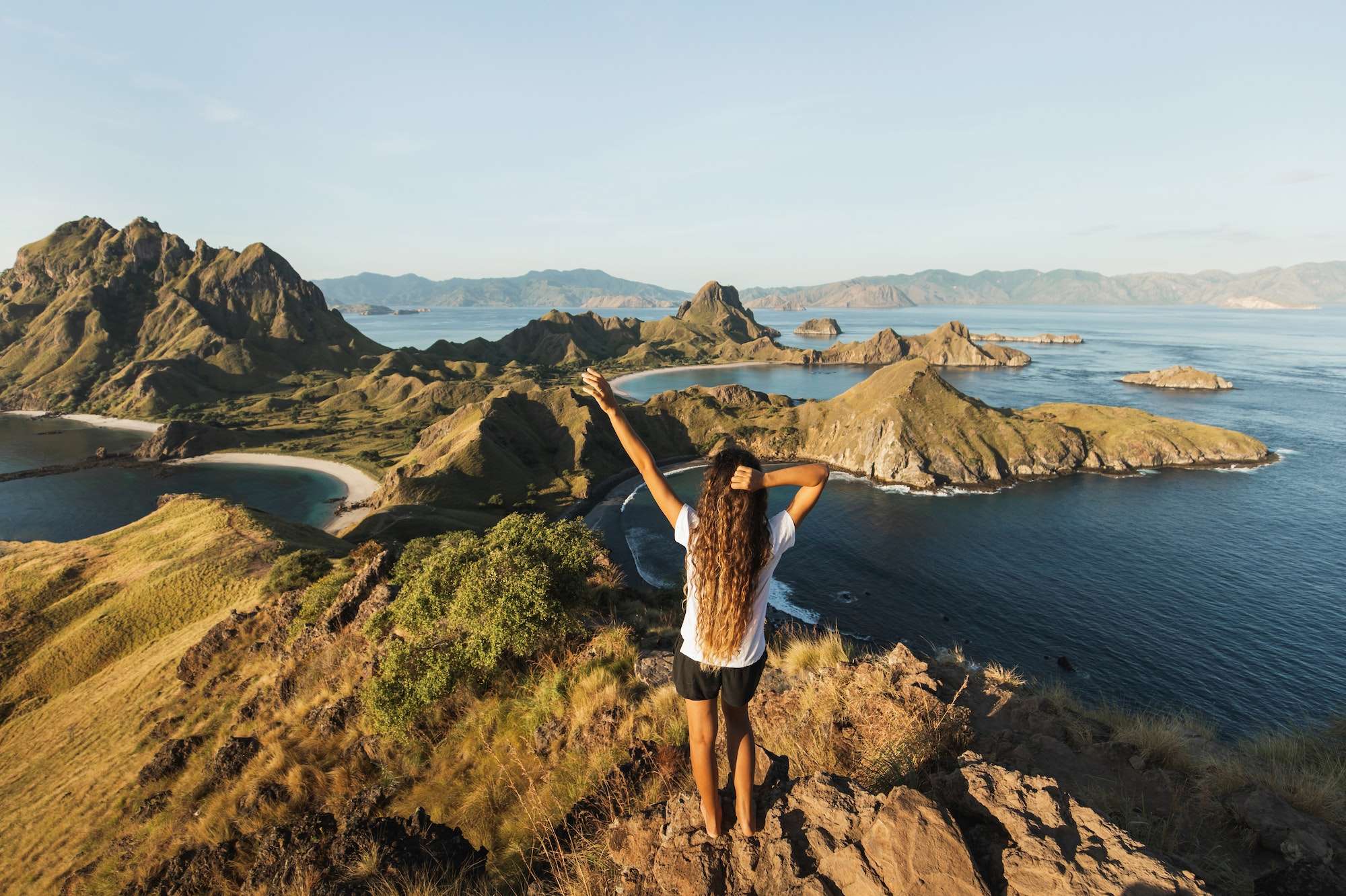 woman with amazing view of padar island in komodo national park indonesia enjoying tropical